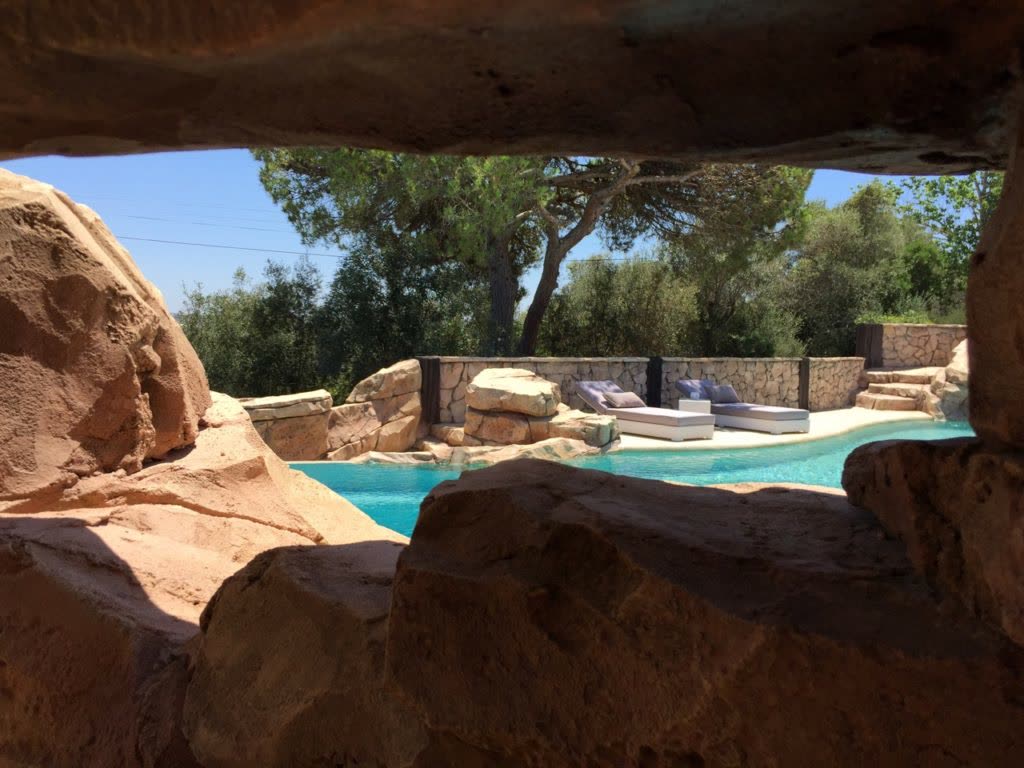 Private swimming pool with sculpted natural rock surround in the Algarve
